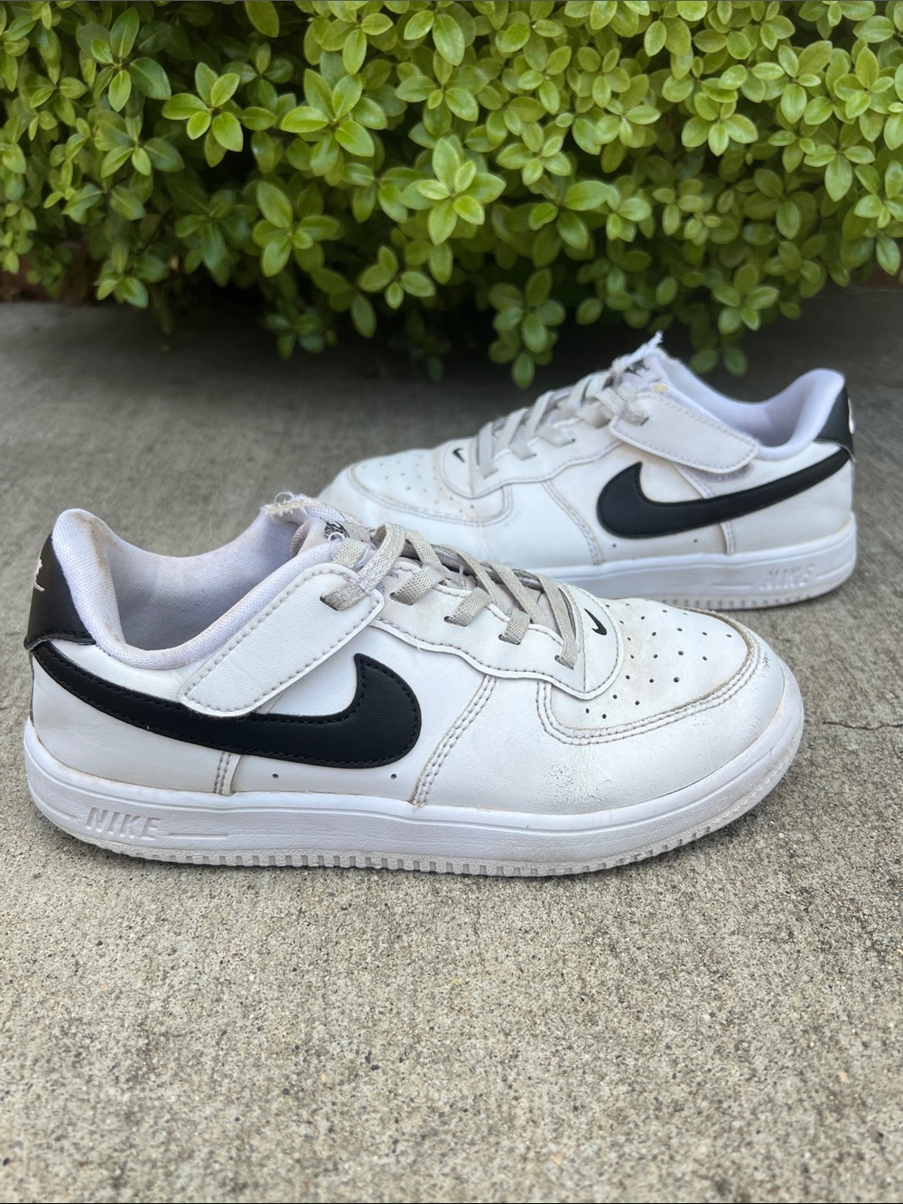 Nike Kids White Sneakers with Black Swoosh